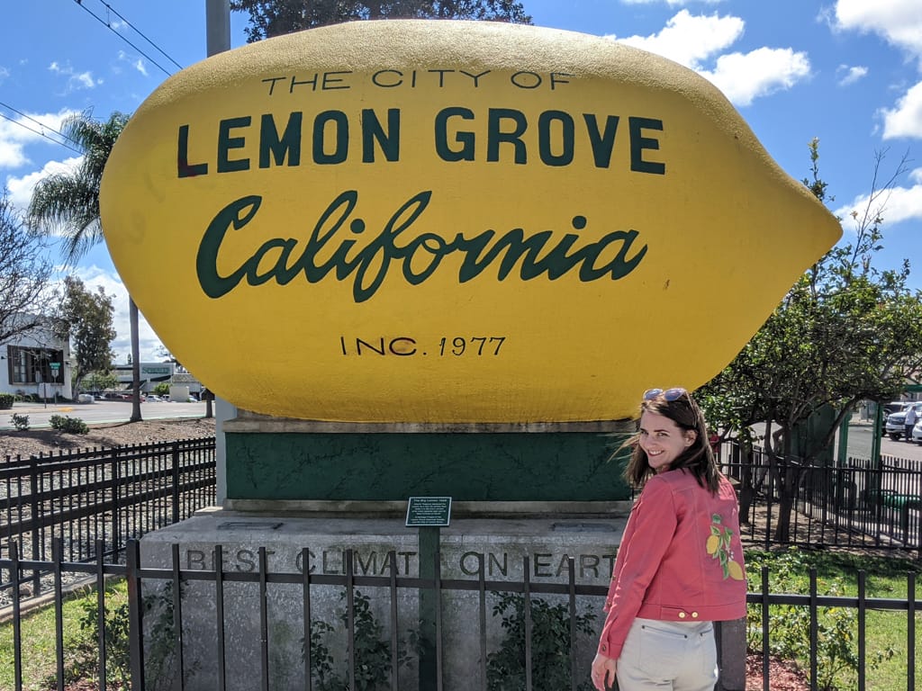 Lemon Jean Jacket in front of Lemon Grove California 